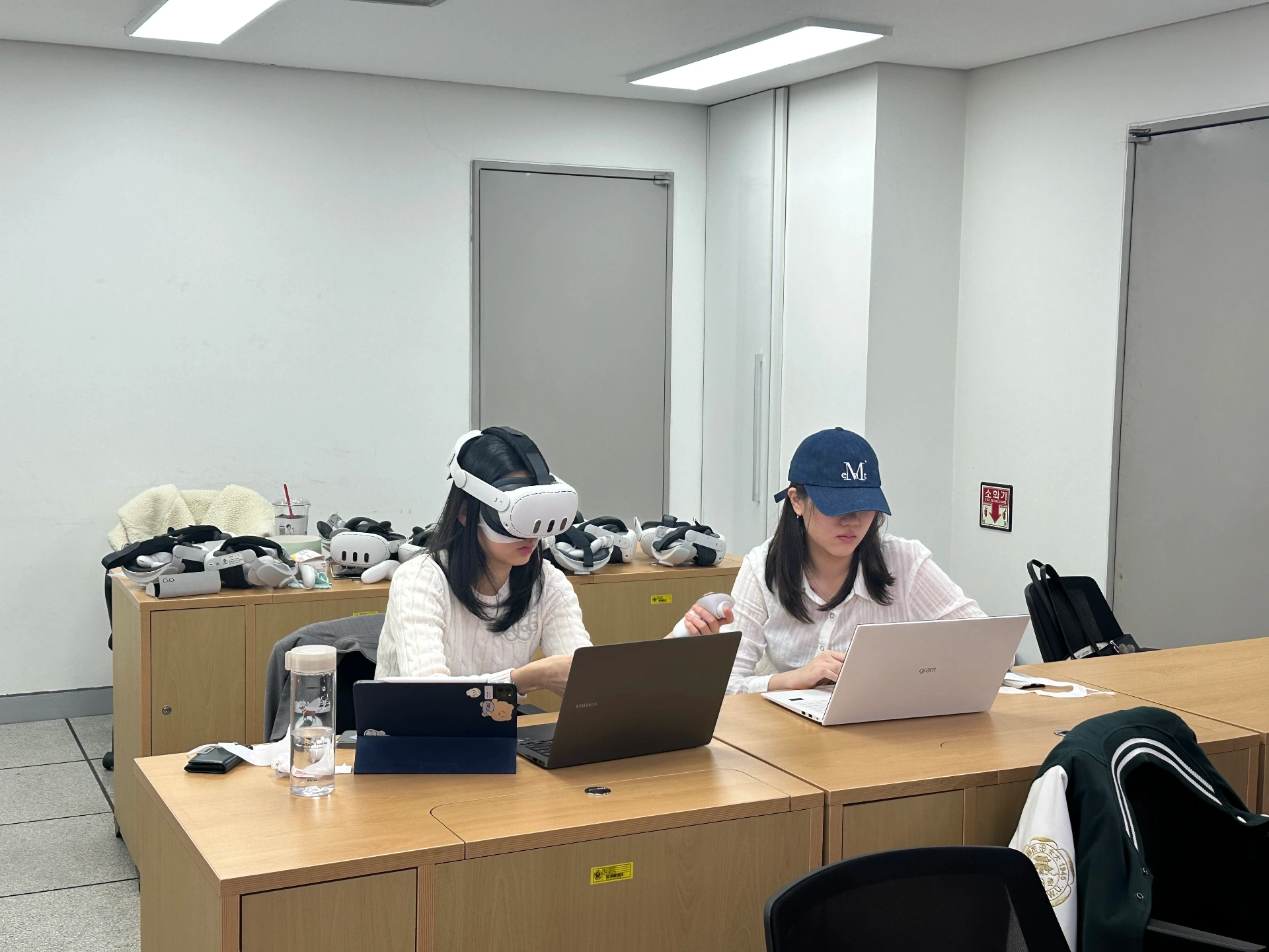 Students using VR headsets in lecture hall